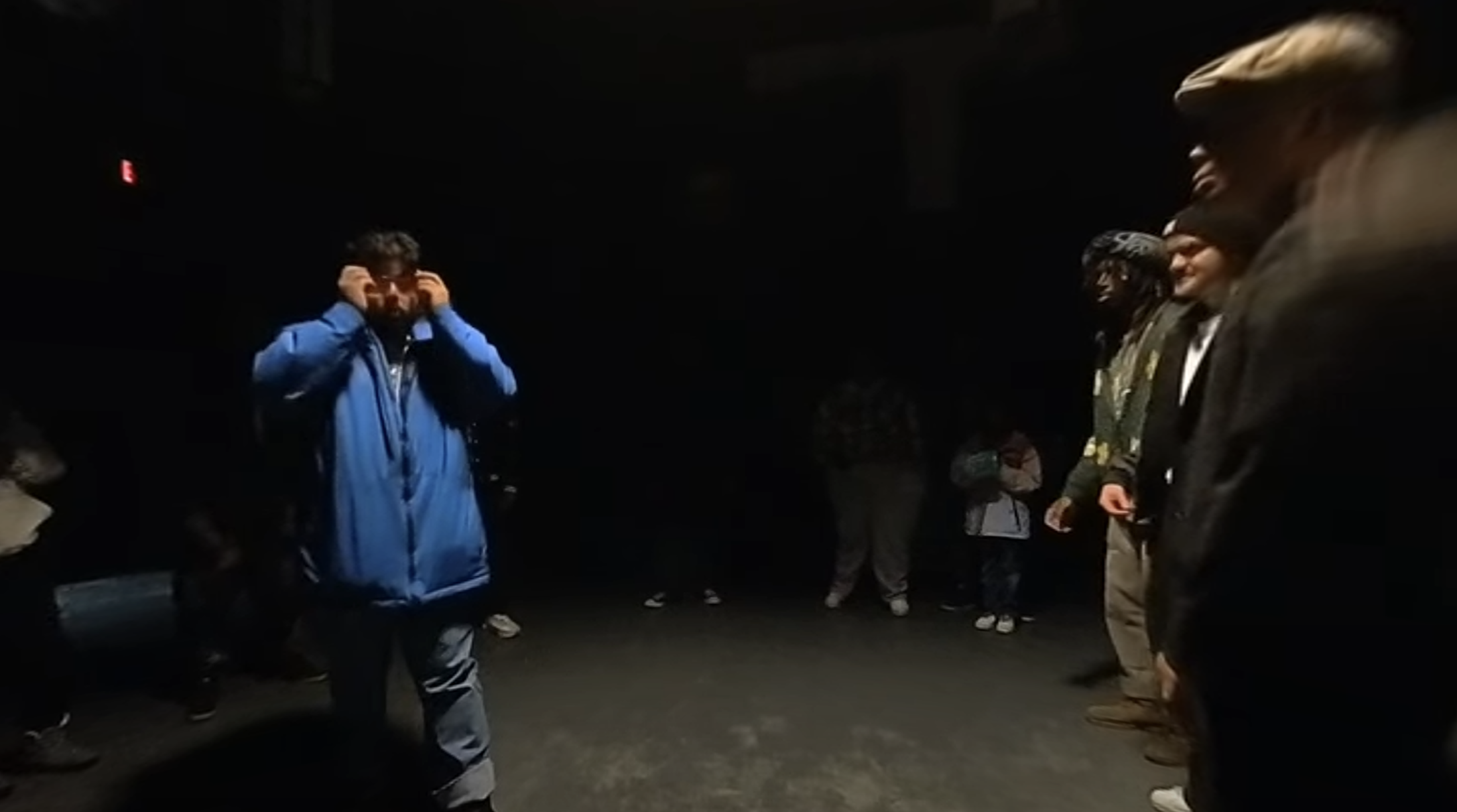 image of people under a spotlight dancing